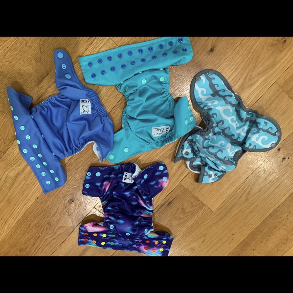 Lot of 4 swim diapers - 3 Lighthouse Kids, 1 Thirsties